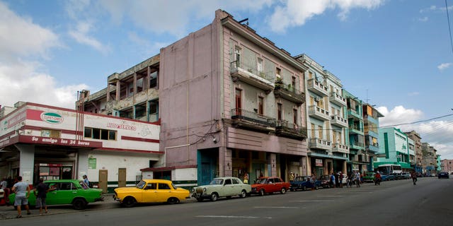 Vehicles wait in a line to fill their gas tanks, in Havana, Cuba, Thursday, Sept. 19, 2019. A fuel shortage blamed on the Trump Administration has turned filling a tank in Cuba into an ordeal even for a country used to waiting in lines.