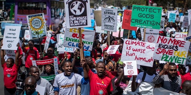 Around a thousand protesters march to demand action on climate change, in the streets of downtown Nairobi, Kenya Friday, Sept. 20, 2019. Protesters around the world joined rallies on Friday as a day of worldwide demonstrations calling for action against climate change began ahead of a U.N. summit in New York.
