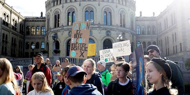 Climate protesters demonstrate outside Norwegian parliament in Oslo, Friday, Sept. 20, 2019. Protesters around the world joined rallies on Friday as a day of worldwide demonstrations calling for action against climate change began ahead of a U.N. summit in New York. (Berit Roald/NTB Scanpix)