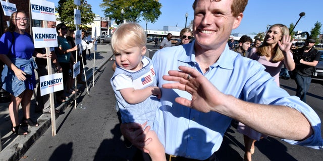 Democratic U.S. Rep. Joseph Kennedy III, D-Mass., waves to supporters as he arrives in East Boston to announce his candidacy for the Senate Saturday. (AP Photo/Josh Reynolds)