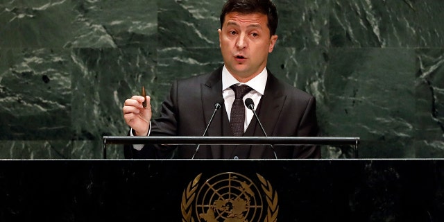 Ukraine's President Volodymyr Zelenskyy holds a bullet as he addresses the 74th session of the United Nations General Assembly, Wednesday, Sept. 25, 2019. (AP Photo/Richard Drew)