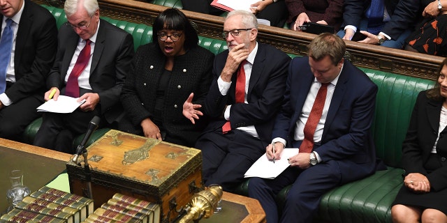 In this handout photo provided by the House of Commons, Britain's Labour party leader Jeremy Corbyn looks on in Parliament in London, Wednesday, Sept. 25, 2019.