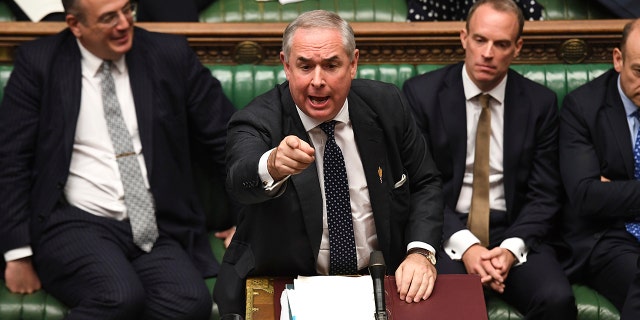 In this handout photo provided by the House of Commons, Britain's General Attorney Geoffrey Cox speaks in Parliament in London, Wednesday, Sept. 25, 2019. (Jessica Taylor/House of Commons via AP)