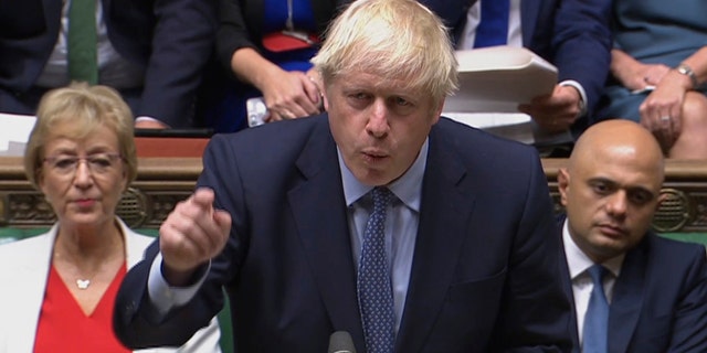 In this handout photo provided by the House of Commons, Britain's Prime Minister Boris Johnson speaks in Parliament in London, Wednesday, Sept. 25, 2019.