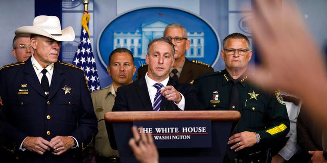 Acting Director of U.S. Immigration and Customs Enforcement Matthew Albence, joined by members of law enforcement, speaks during a news conference at the White House in Washington, Thursday, Sept. 26, 2019. (AP Photo/Carolyn Kaster)