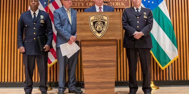 New York City Police Commissioner James O'Neill, center, and others at a news conference on Monday about the death. (AP Photo/Mary Altaffer)