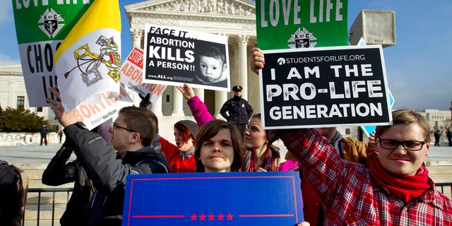In this Jan. 18, 2019, file photo, anti-abortion activists protest outside the Supreme Court during the March for Life in Washington. 