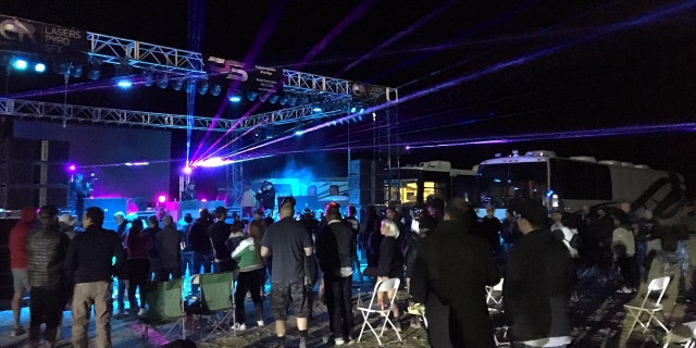 Festival-goers at the Area 51 Basecamp in Hiko, Nev. partake in a "psychedelic" mix by Grammy-nominated electronic dance music DJ and recording artist Paul Oakenfold.