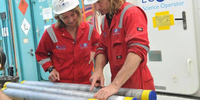 Sean Gulick (right), a research professor at The University of Texas at Austin Jackson School of Geosciences and lead author of the asteroid impact study, with co-author Joanna Morgan, a professor at Imperial College London, on the International Ocean Discovery Program research expedition that retrieved cores from the submerged and buried impact crater. Gulick and Morgan co-led the expedition in 2016.