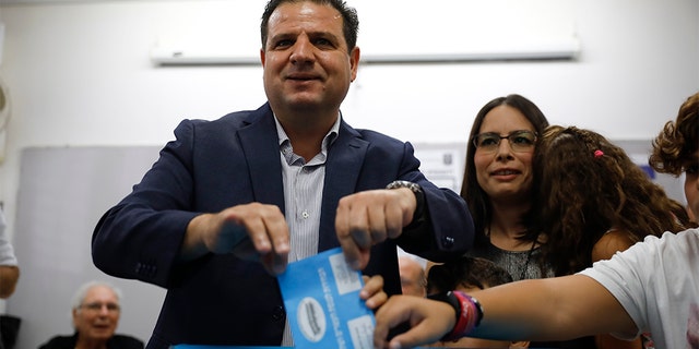 In this Tuesday, Sept. 17, 2019. file photo, Israeli Arab politician Ayman Odeh casts his vote in Haifa, Israel. Israel’s Arab coalition appears poised to emerge as the main opposition bloc following Tuesday’s vote. The historic first would grant a new platform to a long-marginalized minority and the only major political movement still pushing for peace with the Palestinians.