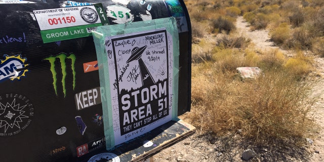 Stickers and signatures on "The Black Mailbox."