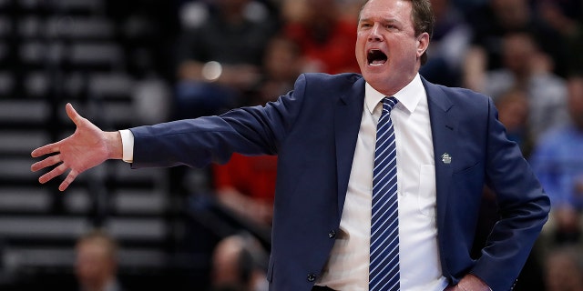 FILE - In this March 21, 2019, file photo, Kansas head coach Bill Self reacts in the first half during a first round men's college basketball game against Northeastern in the NCAA Tournament in Salt Lake City. (AP Photo/Jeff Swinger, File)