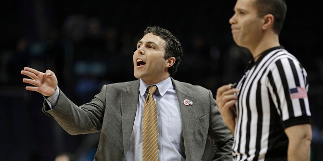 FILE - In this March 12, 2019, file photo, Georgia Tech head coach Josh Pastner, left, directs his team against Notre Dame during the first half of an NCAA college basketball game in the Atlantic Coast Conference tournament, in Charlotte, N.C. (AP Photo/Nell Redmond, File)