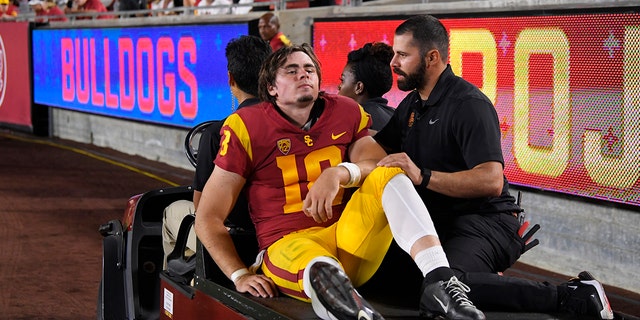 Southern California quarterback JT Daniels is carted off the field after being injured during the first half of an NCAA college football game against Fresno State Saturday, Aug. 31, 2019, in Los Angeles.