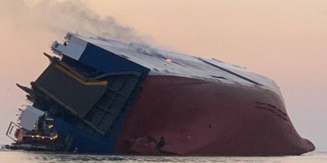 View provided by the coat guard of the listing ship shows a fire aboard