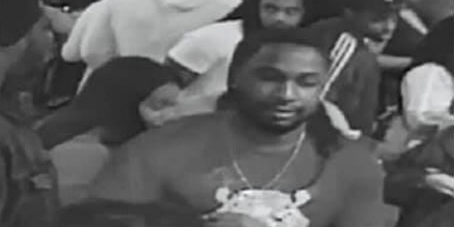 Police are on the hunt for this suspect reportedly captured on video smashing another man in the head with a bowling ball at an event in the Chicago area on Wednesday night, resulting in the victim being placed in a coma.