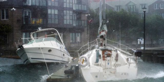 Waves crash into boats long the waterfront in Halifax, Nova Scotia as hurricane Dorian approaches on Saturday, Sept. 7, 2019.