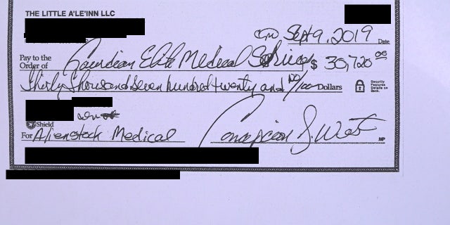 Copy of signed check made out to Guardian Elite Medical Services, which has a contract with Connie West to provide medical teams for AlienStock.