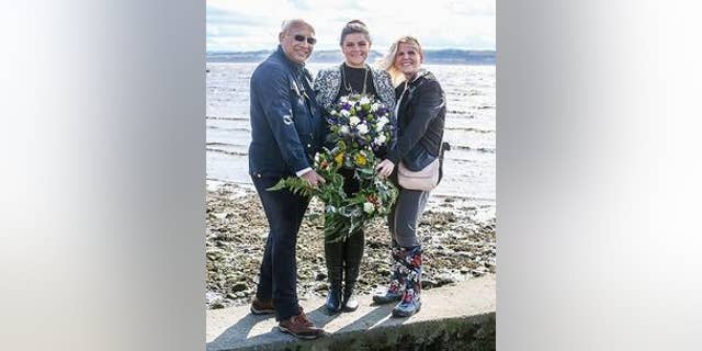 Councillor Julie Ford of Fife Council (center) during the wreath-laying ceremony on Torryburn beach. (Fife Council)