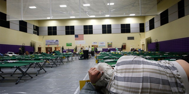 An evacuee on a cot at a shelter for people with special needs on Sunday in Stuart, Fla., ahead of Hurricane Dorian.