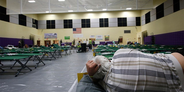 An evacuee on a cot at a shelter for people with special needs on Sunday in Stuart, Fla., ahead of Hurricane Dorian.