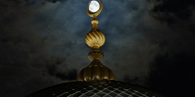 The full moon rises on Hz. Hatice Mosque in the province of Samsun, Black Sea, September 13, 2019. (Photo by Veysel Altun / Anadolu Agency via Getty Images)