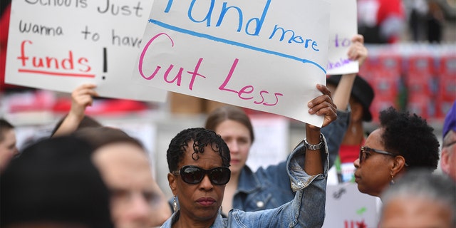 WASHINGTON, DC  APRIL 25:   Teachers, students, and members of the Teachers Union gather and rally against budget cuts and under funding of District of Columbia Public Schools at Freedom Plaza  in Washington, DC on April 25, 2019 (Photo by Marvin Joseph/The Washington Post via Getty Images)