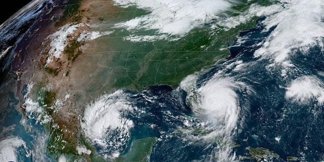 This image, taken on Tuesday, Sept. 3, 2019, shows a tropical depression in the Gulf of Mexico off northeast Mexico as Hurricane Dorian can be seen spinning just off the coast of Florida.