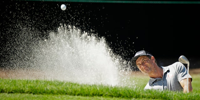 Adam Scott, of Australia, follows his shot out of a bunker onto the seventh green of the Silverado Resort North Course during the first round of the Safeway Open PGA golf tournament Thursday, Sept. 26, 2019, in Napa, Calif. (AP Photo/Eric Risberg)