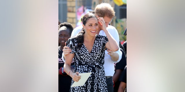 Meghan, Duchess of Sussex smiles as she visits a Justice Desk initiative in Nyanga township, with Prince Harry, Duke of Sussex, during their royal tour of South Africa on September 23, 2019, in Cape Town, South Africa. The Justice Desk initiative teaches children about their rights and provides self-defense classes and female empowerment training to young girls in the community.