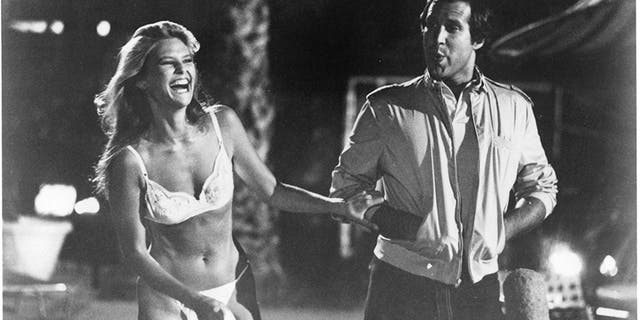 Actress Christie Brinkley and actor Chevy Chase on the set of Warner Bros. movie "National Lampoon's Vacation" in 1983.