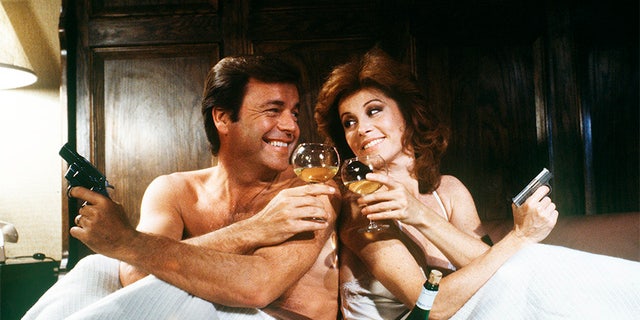 HART TO HART - TV movie - Pilot - 8/25/79, Jonathan and Jennifer Hart (Robert Wagner and Stefanie Powers) were rich, stylish and supersleuths. Jonathan, a self-made millionaire and head of the Hart Industries conglomerate, and Jennifer, an internationally known freelance journalist, roamed the world to solve crimes. In this two-hour TV movie, Jonathan's friend appeared to have committed suicide.