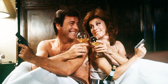 HART TO HART - TV movie - Pilot - 8/25/79, Jonathan and Jennifer Hart (Robert Wagner and Stefanie Powers) were rich, stylish and supersleuths. Jonathan, a self-made millionaire and head of the Hart Industries conglomerate, and Jennifer, an internationally known freelance journalist, roamed the world to solve crimes. In this two-hour TV movie, Jonathan's friend appeared to have committed suicide.