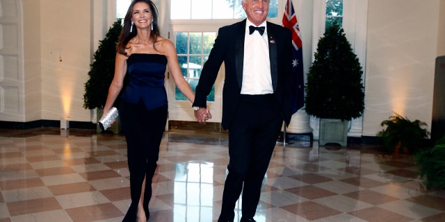 Golfer Greg Norman and wife Kirsten Kutner arrive for Friday night's state dinner. (AP Photo/Patrick Semansky)