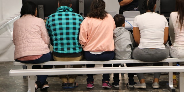 Migrants wait in a processing room in a Migrant Protection Protocol (MPP) center in Laredo, Texas. (Adam Shaw/Fox News)