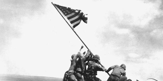 Flag raising on Iwo Jima. From left, PFC Ira Hayes, PFC Harold Schultz, Sgt. Michael Strank (KIA), PFC Franklin Sousley (KIA), PFC Harold Keller, Cpl. Harlon Block (KIA). Other service members have been identified as the flag raisers over the years. These six Marines have been identified as of the most recent research by the Marine Corps in 2019. 