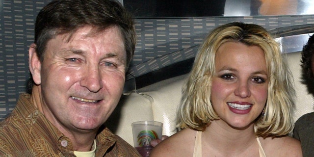 Singer Britney Spears (2nd,L) and family (L-R), father Jamie, brother Bryan and mother Lynne celebrate with Jamie Spears's partners (not shown) George and Phil Maloof and John Decastro, at the launch party for their new Palms Home Poker Host software held at the one of a kind Hardwood Suite at the Palms Casino Resort in Las Vegas.