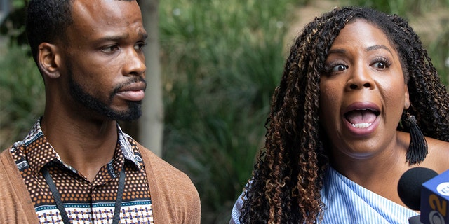 Activist Jasmyne Cannick, co-founder of the National Black Justice Coalition, the nation's largest and oldest Black lesbian, gay, bisexual and transgender civil rights organization is joined by gay activist, Jerome Kitchen, godbrother of Gemmel Moore, the first victim, left, as they comment on the arrest of Los Angeles area gay activist Ed Buck outside the Clara Shortridge Foltz Criminal Justice Center in Los Angeles on Sept. 19. (AP Photo/Damian Dovarganes)