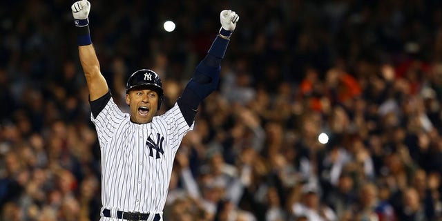 Derek Jeter of the New York Yankees celebrates after a game-winning RBI hit in the ninth inning against the Baltimore Orioles in his last game ever at Yankee Stadium on Sept. 25, 2014, in the Bronx borough of New York City. (Elsa/Getty Images)