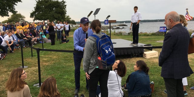 Former Vice President Joe Biden speaks with environmental activist Rebecca Beaulieu during a town hall in New Castle, New Hampshire on Friday, Sept. 6
