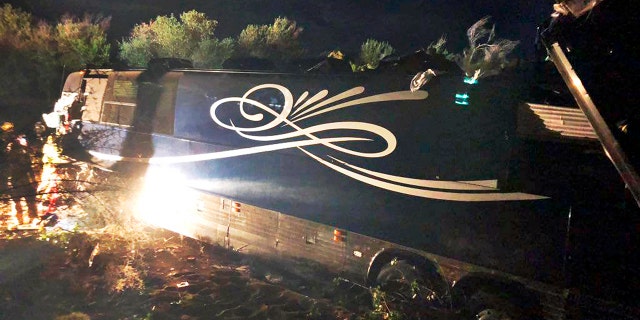 This Wednesday, Sept. 18, 2019 photo provided by the California Department of Forestry and Fire Protection (Cal Fire) shows the scene of the wreck of a tour bus that crashed while carrying the road crew for country Josh Turner, leaving one dead and seven injured, on Highway 46 near Shandon in Cailfornia's Central Coast region.