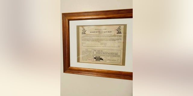 Rob Mathis said he found a framed Ku Klux Klax application displayed in the home of Muskegon Police Officer Charles Anderson during a real estate tour.