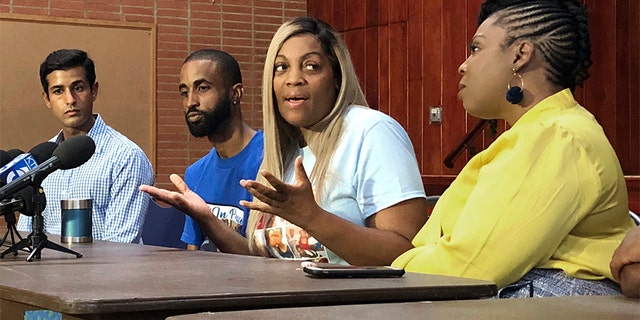In this Wednesday photo, LaTisha Nixon, second from right, talks about her son Gemmel Moore, one of the men who died in the apartment of Democratic donor Ed Buck, at a news conference in West Hollywood, Calif. (AP Photo/Brian Melley)
