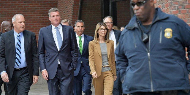 Lori Loughlin and Mossimo Giannulli appeared virtually in court Friday to plead guilty in the college admissions scandal case. 
