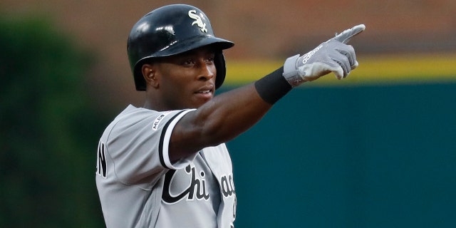 Chicago White Sox's Tim Anderson points to the dugout after hitting a double against the Detroit Tigers during the first inning of a baseball game in Detroit, Friday, Sept. 20, 2019. (AP Photo/Paul Sancya)