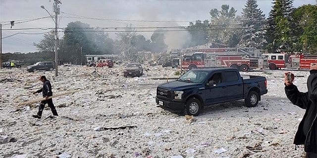 A man working at the scene of the deadly propane explosion Monday. (Jacob Gage via AP)