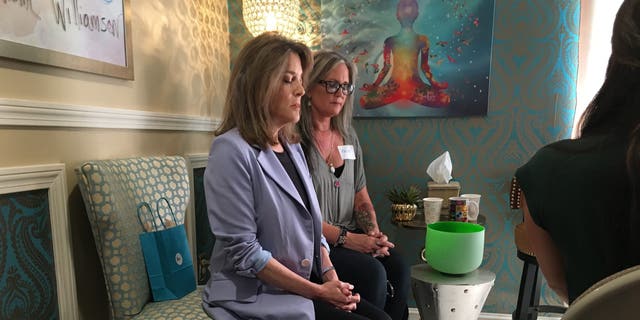 Democratic presidential candidate Marianne Williamson leads a mediation in Manchester, New Hampshire on September 9, 2019