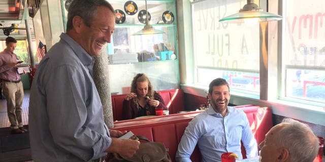 Former South Carolina governor and congressman Mark Sanford, making his first visit to New Hampshire since launching his bid for the 2020 GOP presidential nomination, greets voters at the Airport Diner in Manchester, on Sept. 19, 2019