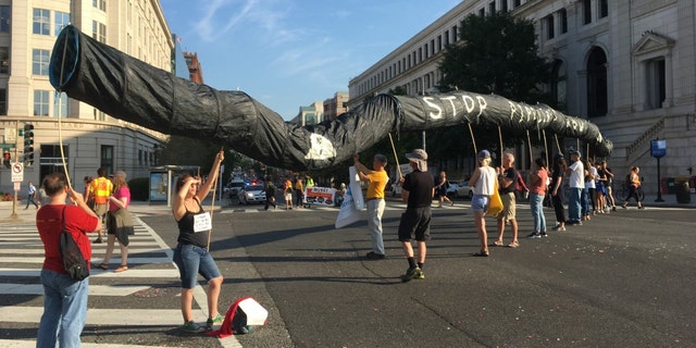 Sept. 23, 2019: Protesters hoist up a fake pipeline near Union Station in Washington, D.C. (Tyler Olson/Fox News) 