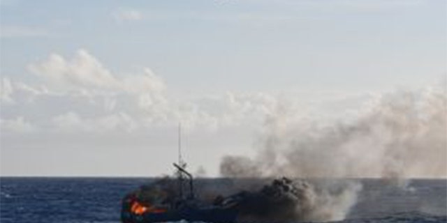 Coast Guard Air Station Barbers Point aircrews and Coast Guard surface assets respond to a vessel fire. (U.S. Coast Guard photo by Ensign Brandon Horacek/Released)